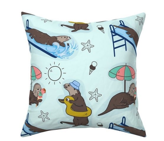 a pillow with a sea otter on it