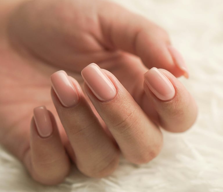 a woman's hand with a manicured manicured nail polish