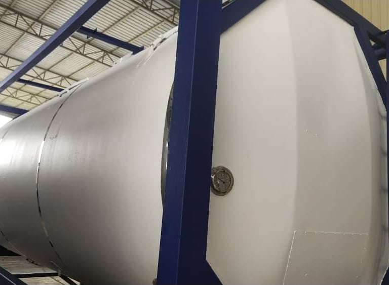 a large white tank sitting on top of a metal rack
