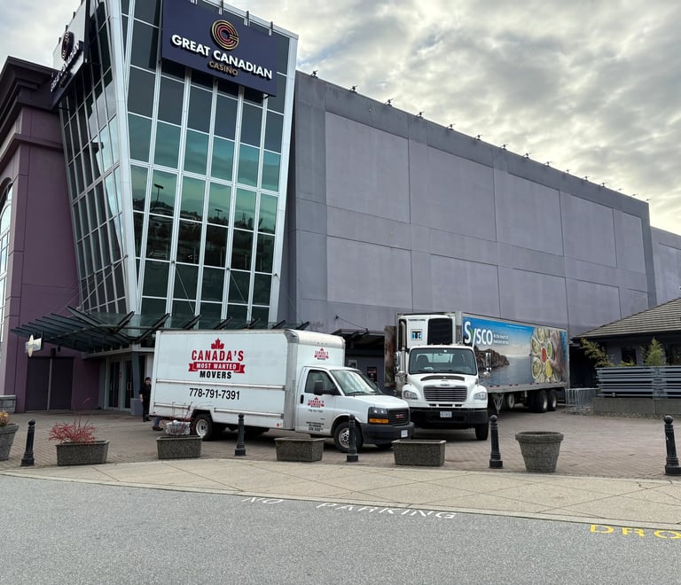 Canada’s Most Wanted Movers trucks parked at Great Canadian Casino Vancouver for a commercial moving job.