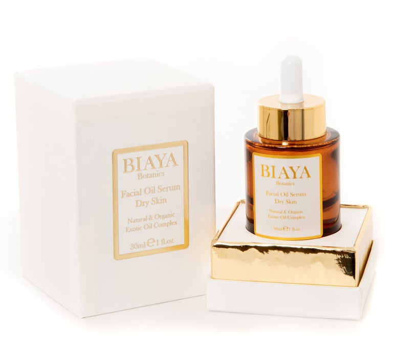 Biaya Botanics Facial Oil Serum Dry Skin in a gold and ivory box with an amber dropper bottle