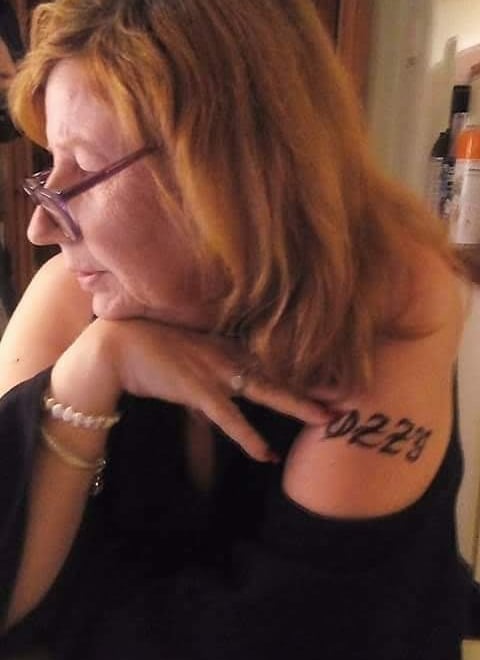 a woman with a tattoo on her arm