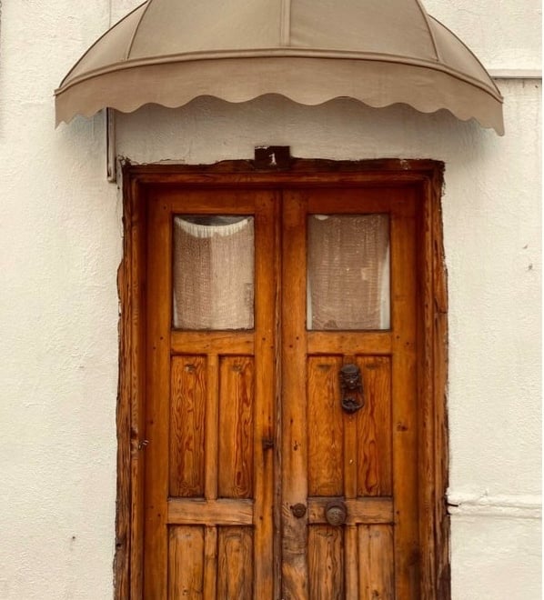 Wooden business door representing commercial locksmith services in Hendersonville and WNC
