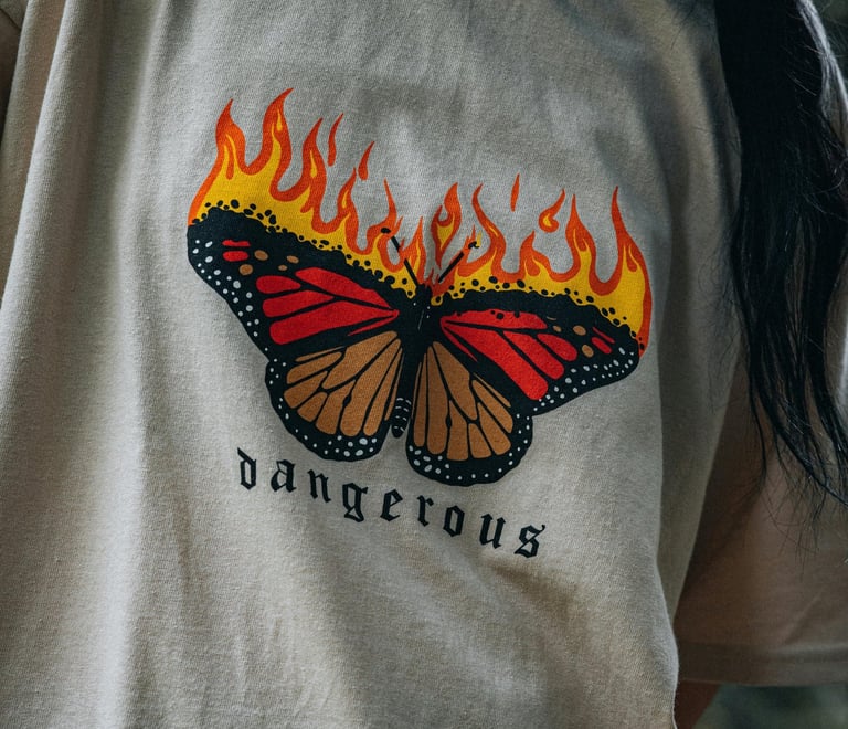a woman with a butterfly butterfly on a white shirt