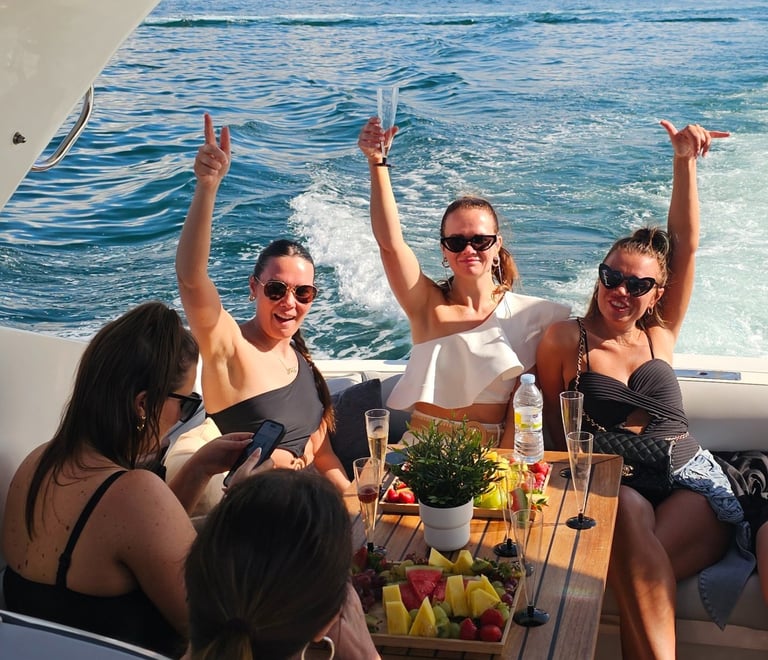 girls toasting with champagne at the yacht