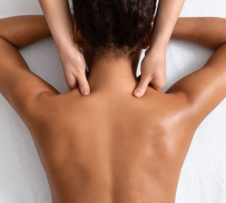 a woman is shown with a man's hands on her back
