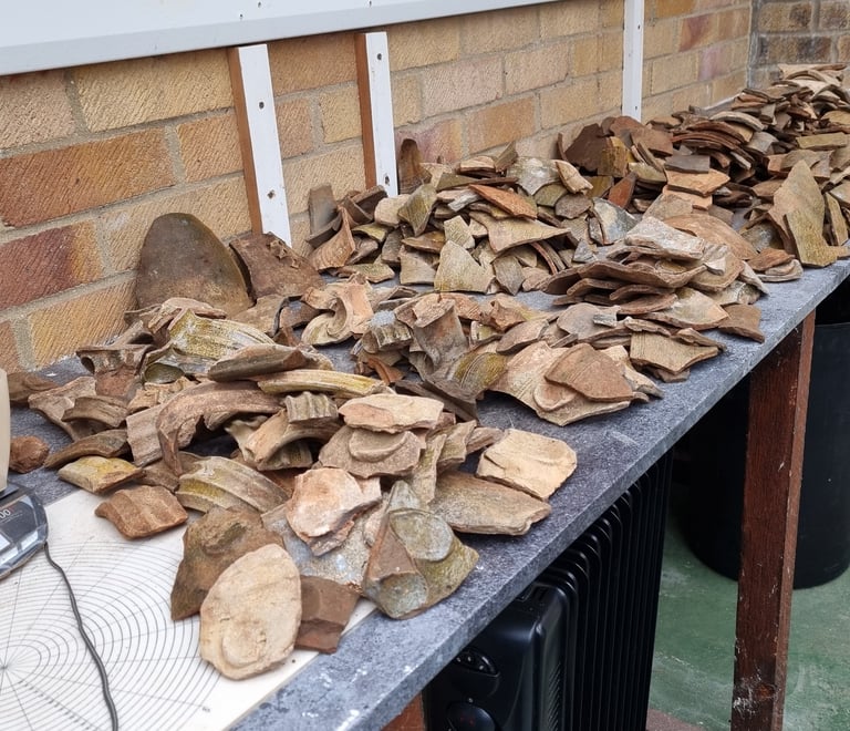 Sorting and recording pottery from a kiln site in Grimston, Norfolk