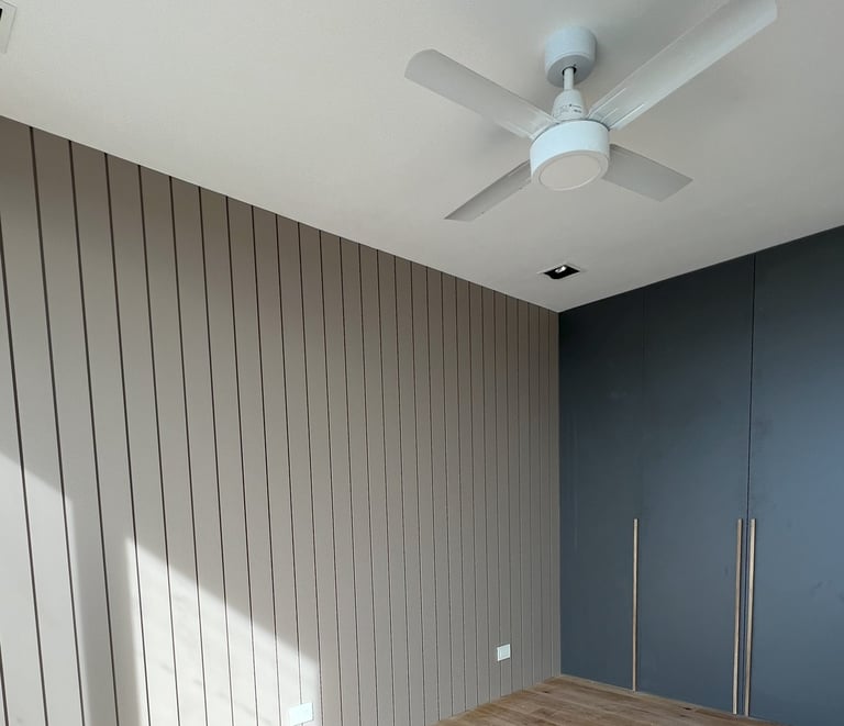 a room with a ceiling fan and a ceiling fan