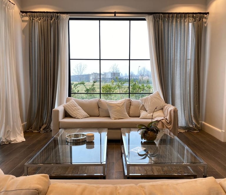 a living room with a couch and a glass table