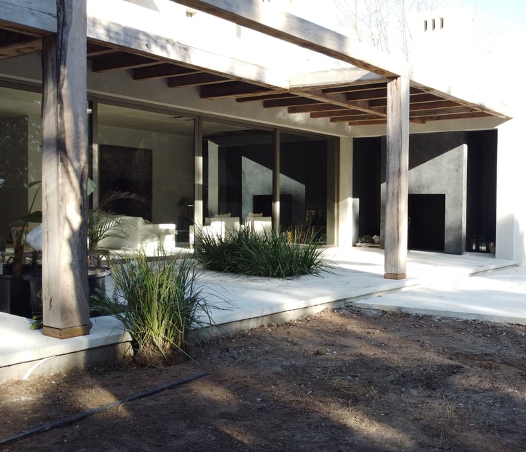 a house with a pool and a pool in the background