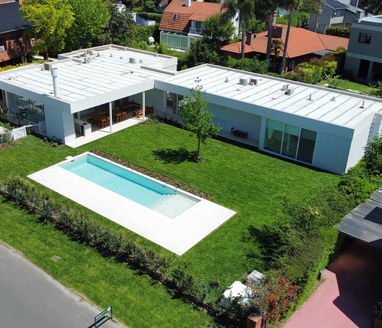 a house with a pool and a swimming pool