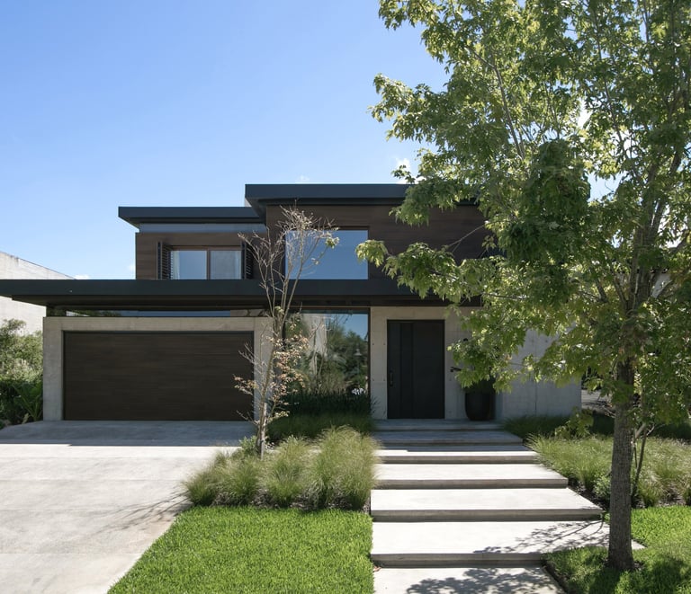 a house with a driveway and steps leading up to a driveway