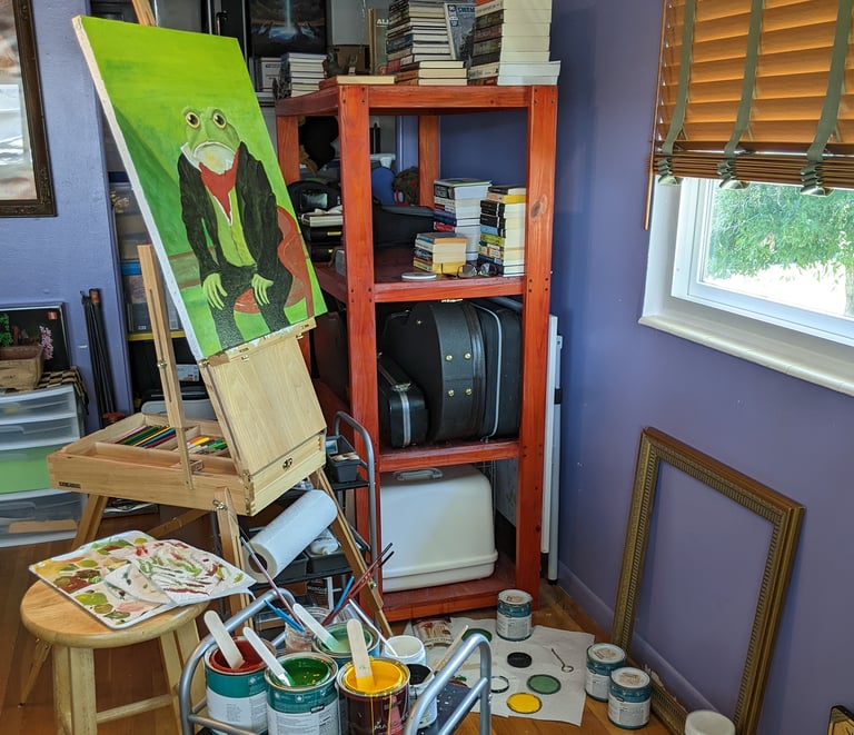 Kathy LaFollett's art studio showing a canvas art painting in progress.