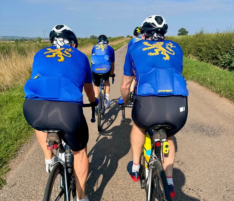 a group of people riding bikes down a road