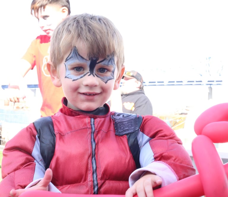 Little boy showing his face paint