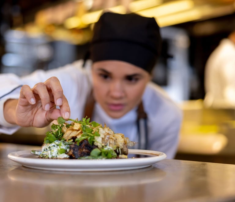 a chef is preparing to serve a meal
