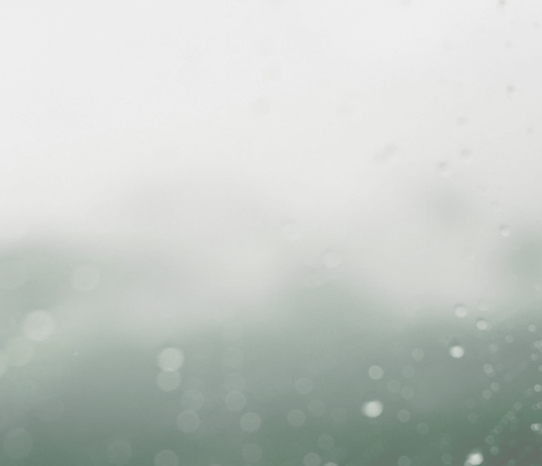 Abstract misty gradient from soft green to white, with delicate out-of-focus water spots.