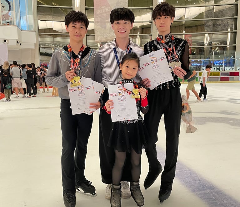 a group of people standing around a child's hand holding up their certificates