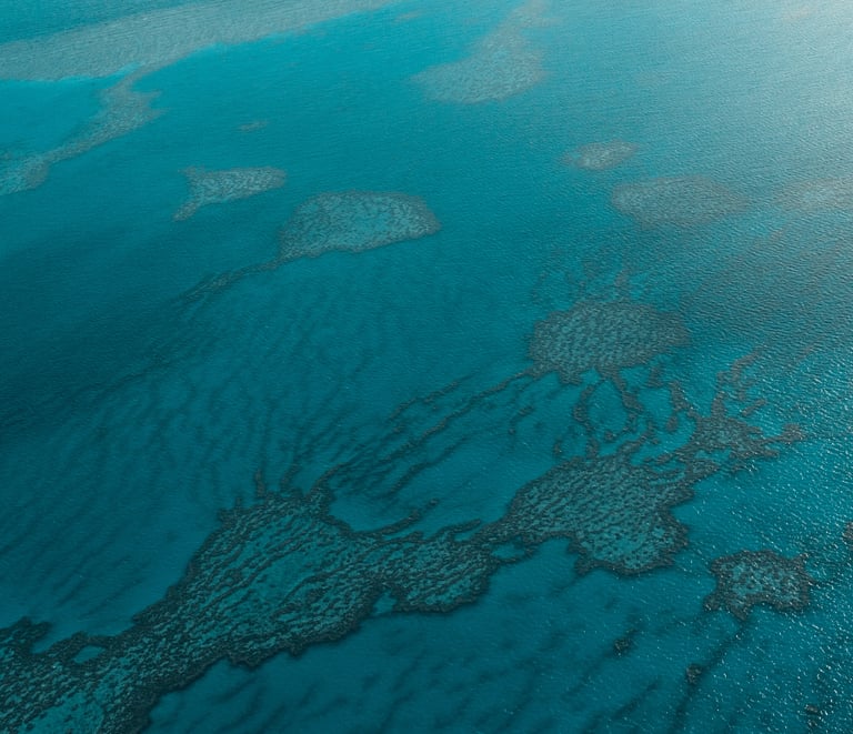 a plane flying ove of water