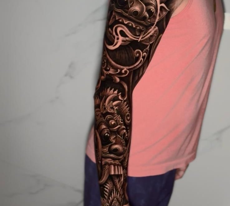 Balinese barong tattoo design on forearm