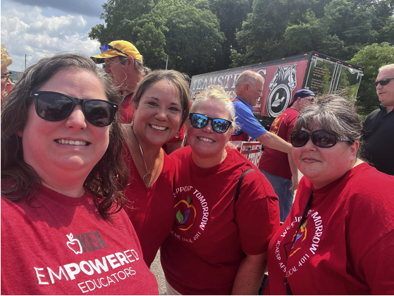 4 women in red "Empowered Educators" tshirts on