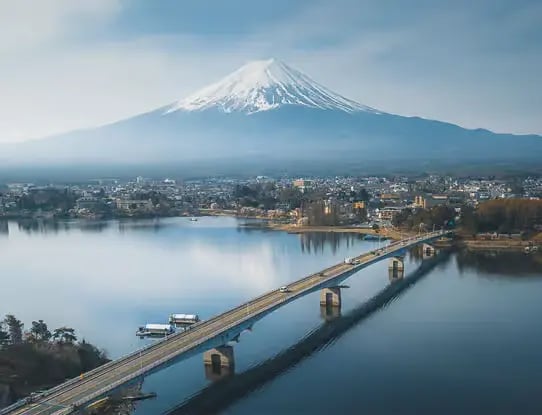 Lake Kawaguchiko Bridge crossing with a majestic view of Mt. Fuji, a popular driving route for touri