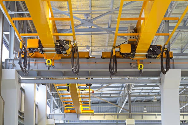2 bridge cranes with rope hoists lined up for inpsection