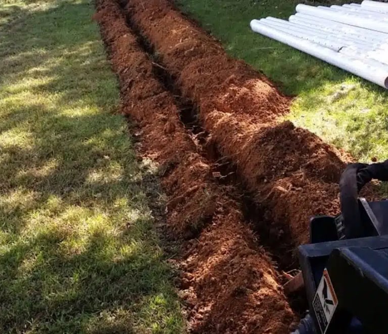 Professional buried downspout installation in Atlanta to prevent erosion and protect home from water