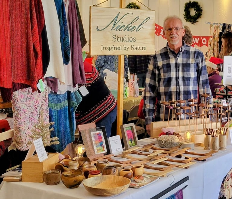 Photo of Nickel Studios vendor table at a fiber conference. Depicts items listed on this website. 