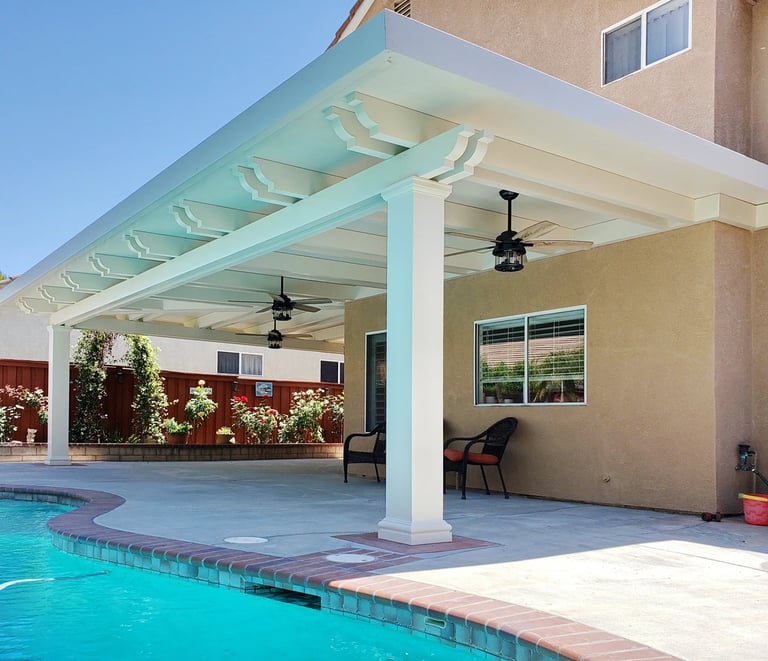 Large white covered patio next to pool.