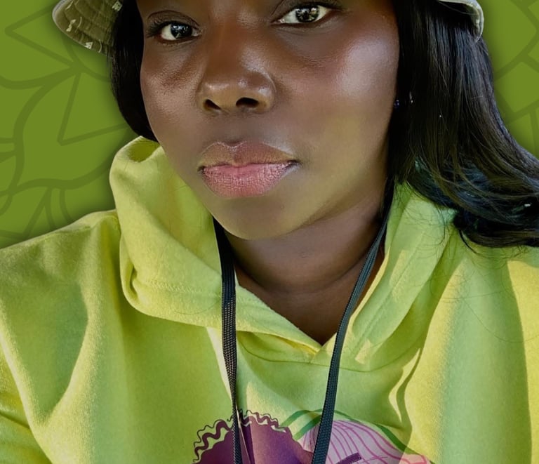 Black woman wearing a grey bucket hat and lime green graphic hoodie against a green leaf background.