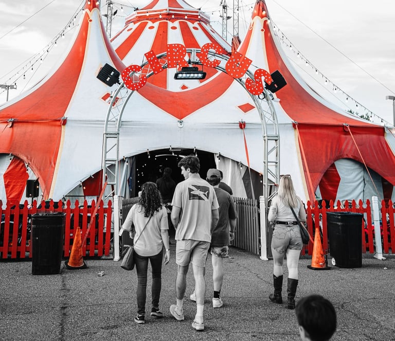 a circus tent with people walking around it