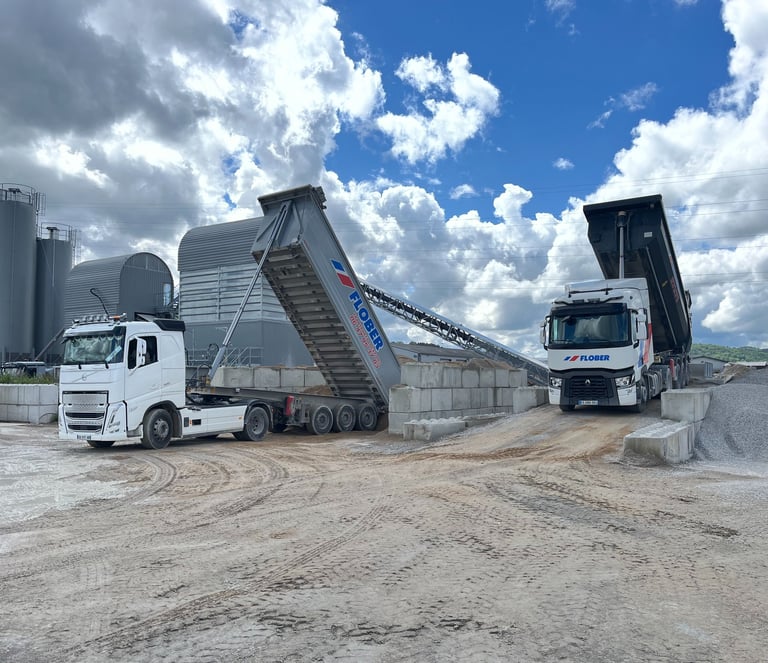 a truck with a dumpster and a dumpster