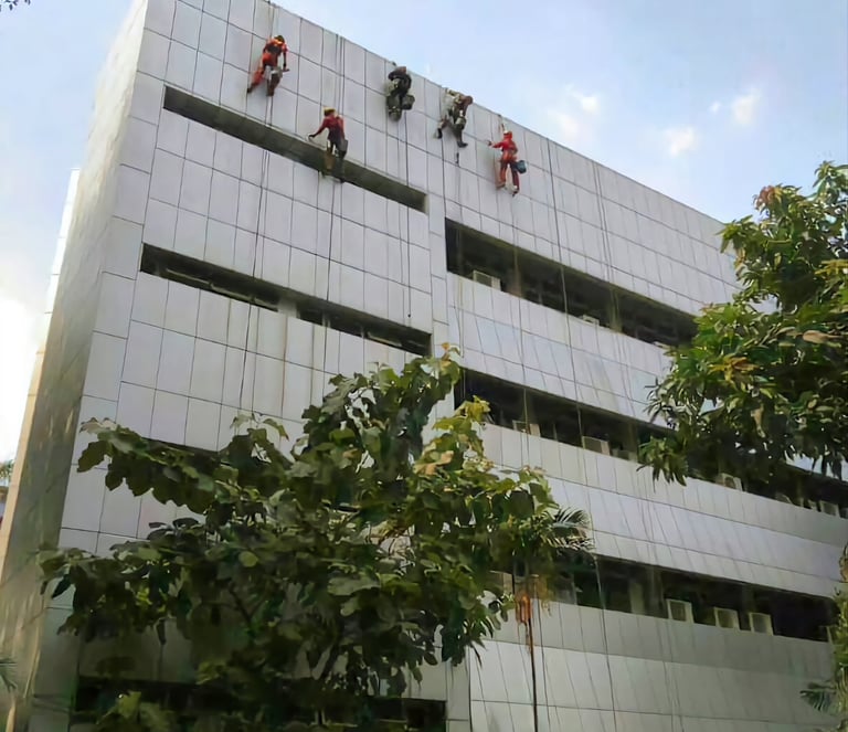 a group of people hanging from a building
