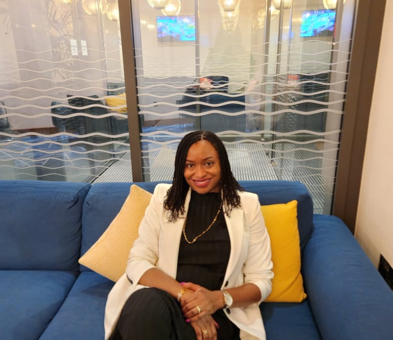 a woman sitting on a couch in a room