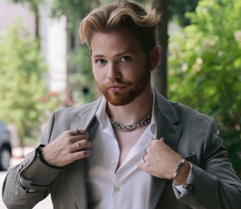 a man in a suit jacket and a white shirt