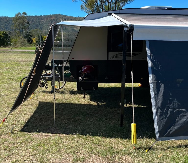 Front or rear caravan awning extension with privacy screen drop for extra shade and shelter