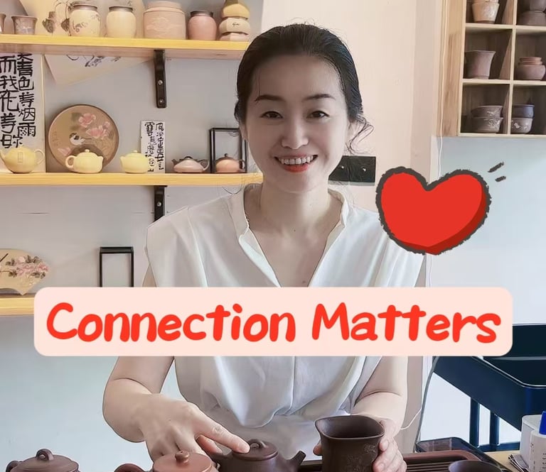 Woman smiling while holding a teapot.