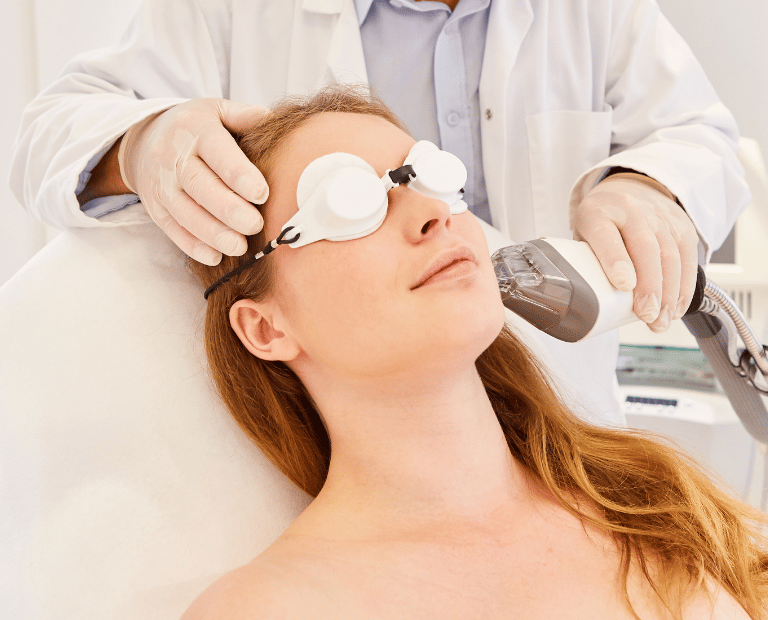 woman getting fraxel laser treatment on face