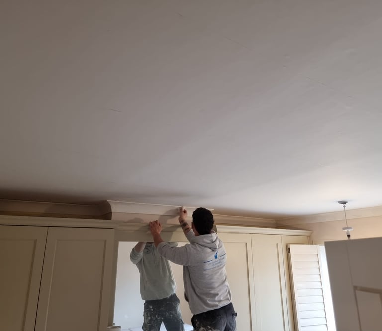 Our staff decorating an interior room in a residential home.
