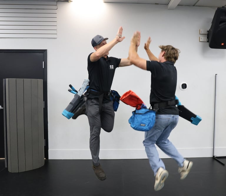 two window cleaners excited about their great work