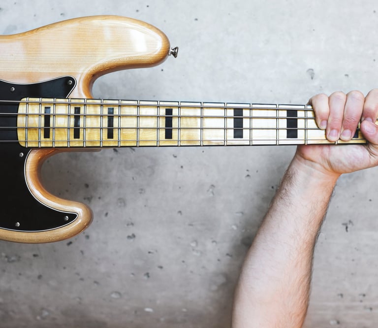 Triumphant bass player at Bass by Ear bass guitar lessons