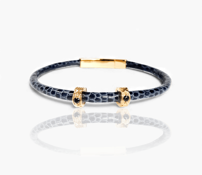 Luxury blue leather bracelet with gold accents and black crystals