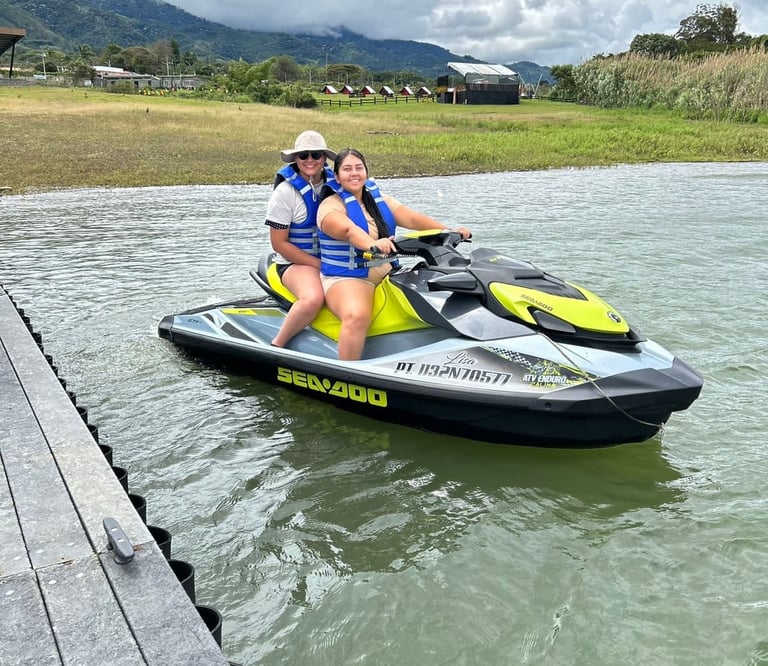a woman and a man riding a jet skis