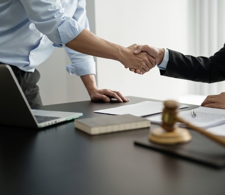 lawyer shaking hands with client