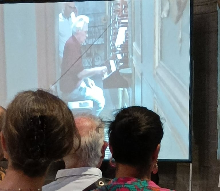 The organist takes his seat