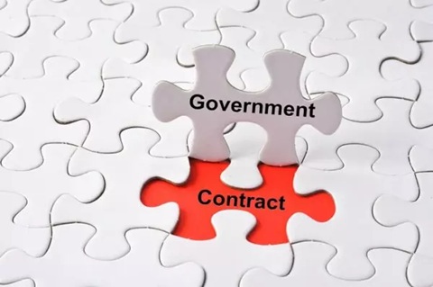 A white puzzle piece labeled government fitting into a red slot labeled contract.