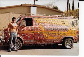 a man standing next to a van with a large amount of paint