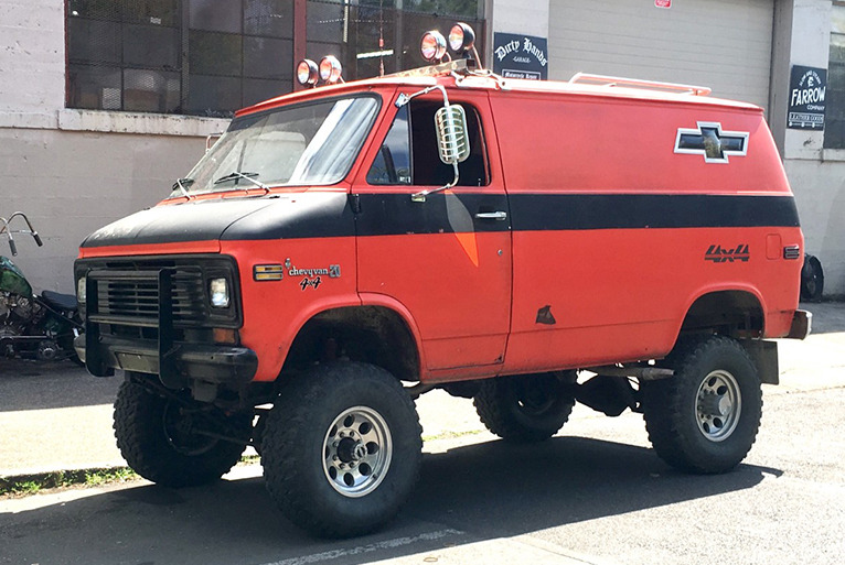 a lifted red van