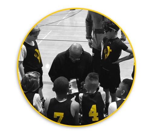 Pic of Infinite Training AAU Basketball Team in huddle with coach Joell Crawford